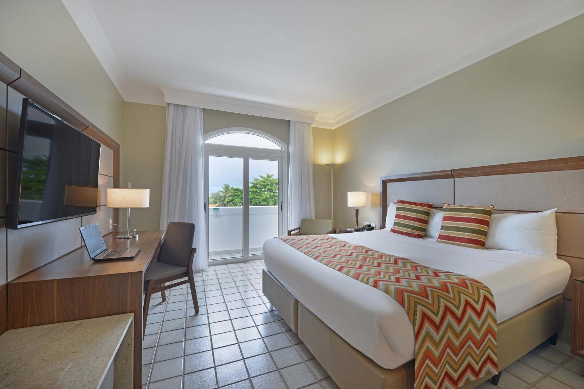 Hotel Deville Prime Salvador Luaran gambar A room at the hotel